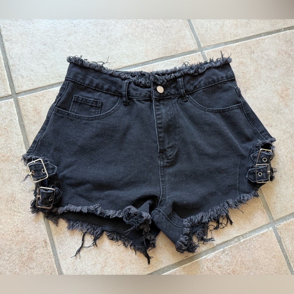 Jeans brand black short shorts size 2/4 with side buckles fringe bottom